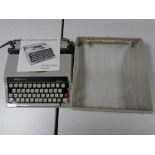 A cased Boots PT800 typewriter with instruction book