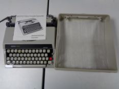 A cased Boots PT800 typewriter with instruction book