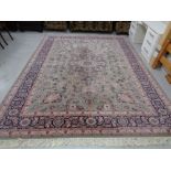 A machined carpet of Tabriz design, on green ground,