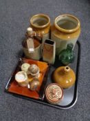 A tray of antique glazed pottery storage jars and bottles, onyx egg, cup,