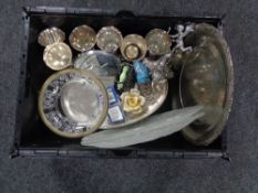 A crate of metal ware including serving trays, goblets,