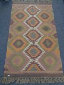 A flatweave rug,