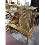 A teak lattice storage box and folding table together with a refectory coffee table