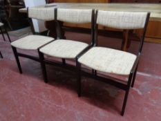 A set of six 20th century dining chairs upholstered in a beige fabric