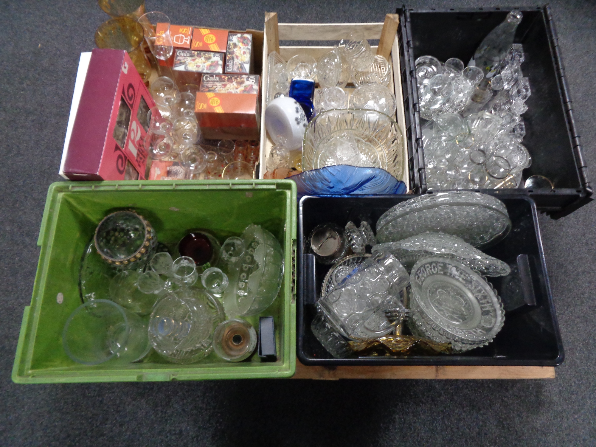 A pallet of five boxes of glass ware