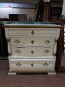 A 19th century white and gilt painted Empire style four drawer chest