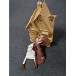 A cloth doll together with an unfinished wooden doll's house