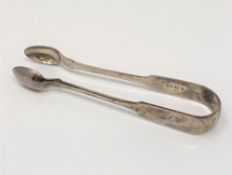 A pair of William IV silver sugar tongs, Reid & Sons,