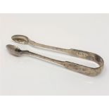 A pair of William IV silver sugar tongs, Reid & Sons,