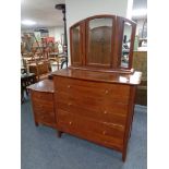 A Willis & Gambier three drawer serpentine fronted chest with triple mirror and matching bedside