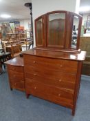 A Willis & Gambier three drawer serpentine fronted chest with triple mirror and matching bedside