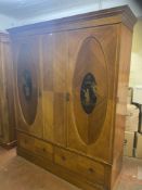 A Victorian inlaid mahogany double door wardrobe fitted two drawers with Chinoiserie panel doors