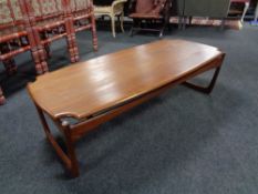 A 20th century shaped teak coffee table