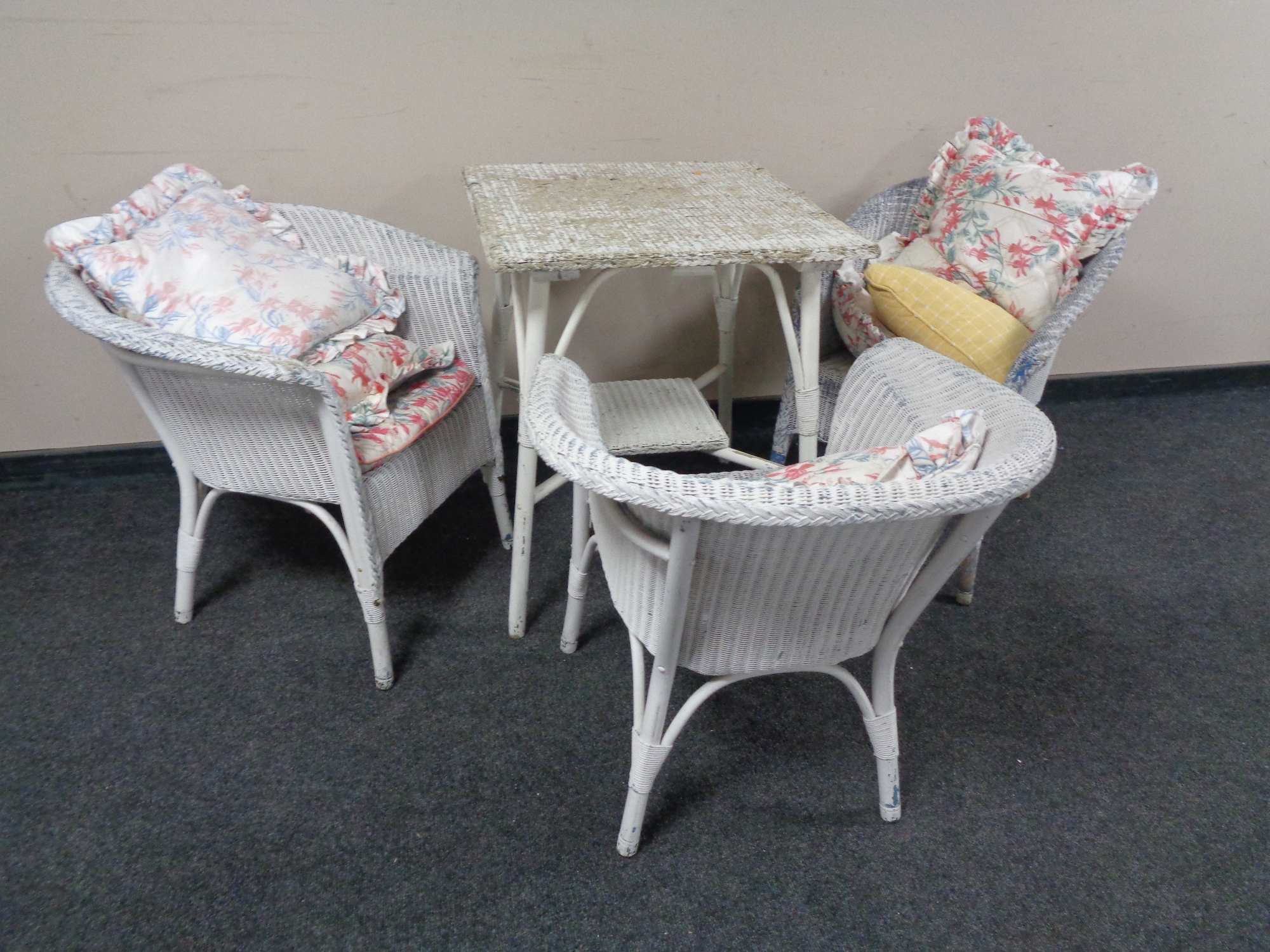 A square painted loom topped table and three matching chairs