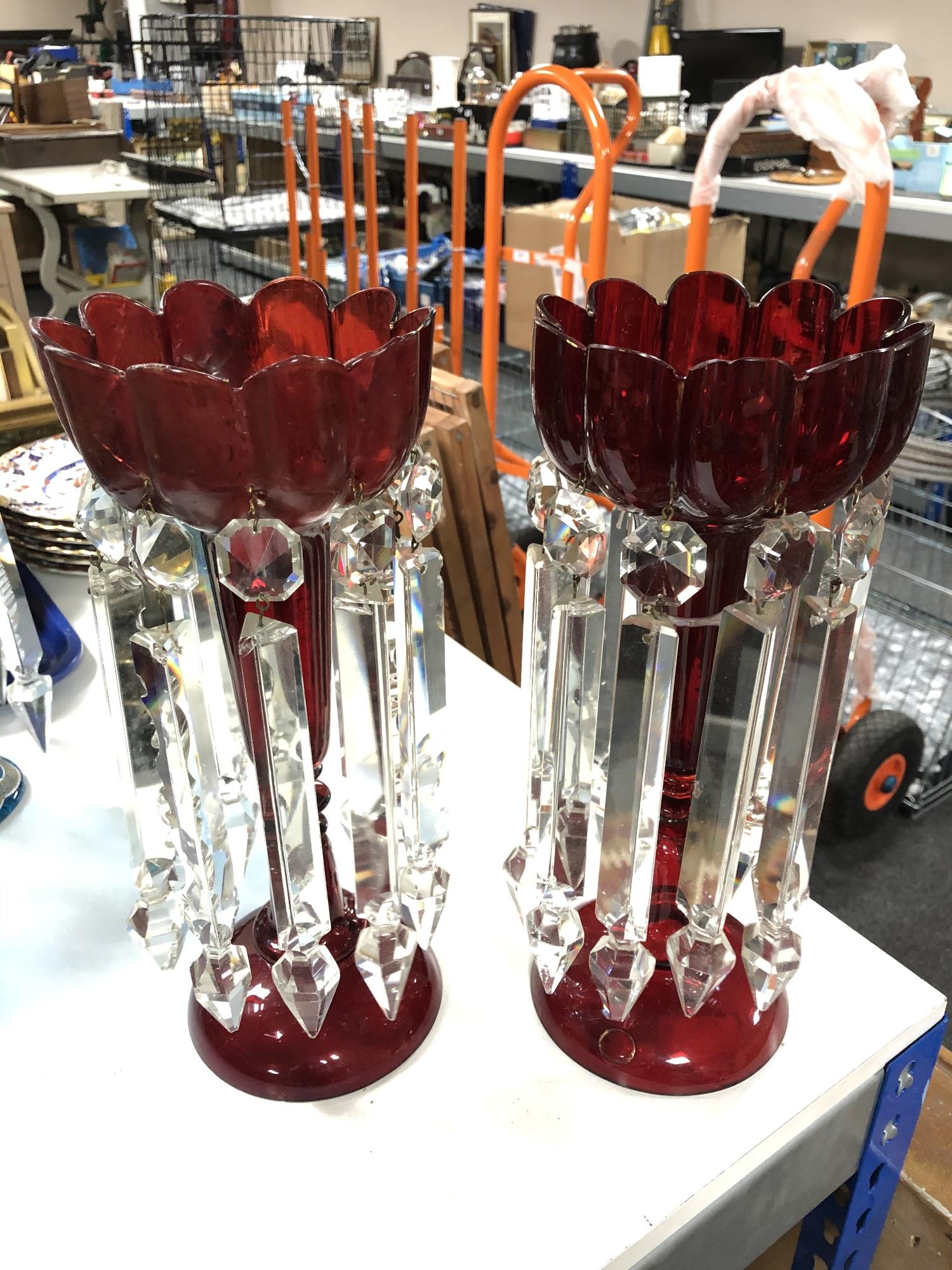 A pair of red glass lustres with drops CONDITION REPORT: Height 32cm.