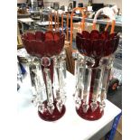 A pair of red glass lustres with drops CONDITION REPORT: Height 32cm.