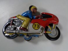 A 20th century tinplate wind up motorcycle,