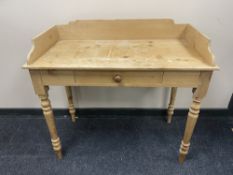 An antique stripped pine wash stand fitted a drawer CONDITION REPORT: 96cm wide by