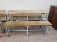 A pine and scaffold table and matching benches,