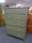 A painted pine Ikea seven drawer chest with glass handles