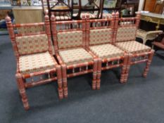 A set of four painted Indian style dining chairs