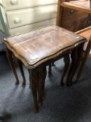 A nest of three inlaid mahogany tables