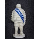 A cast iron door stop modelled as a Michelin Man