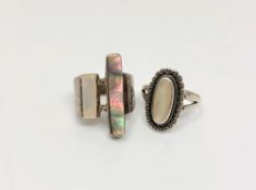 Two silver and abalone dress rings.