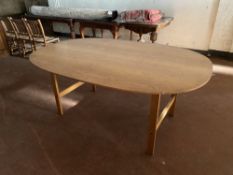A 20th century oval oak dining table, 180cm long by 120cm wide by 75cm high.
