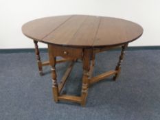 A Victorian oak gate leg table