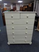 A painted pine seven drawer chest