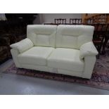 A cream leather two seater bed settee