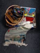 A box of wicker hand basket, Chinese rug, books, table linen,