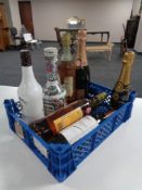 A basket of eight bottles of alcohol including Louis Roederer Champagne, Lancing Champagne,