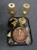 A tray of 20th century brass wares including pair of ornate candlesticks, horse brasses,