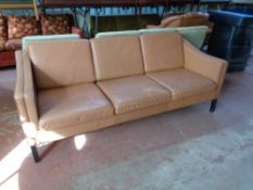 A 20th century Danish Stouby brown leather three seater settee CONDITION REPORT: