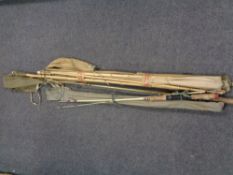 A bundle of assorted fishing rods to include Hardy's split cane rod, bamboo rods,
