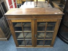 An Edwardian double door glazed bookcase top, 94cm wide by 30c deep by 92cm high.