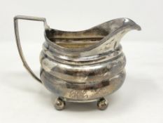 A Georgian silver cream jug, no city mark, maker IR & TW.