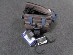A camera bag containing Olympus 35 RC camera, Praktica MTL50 camera, assorted lenses,