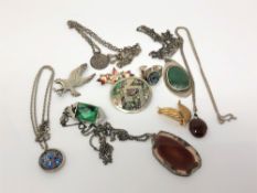 A malachite pendant on silver chain, a silver abalone brooch and similar ring, silver eagle brooch,