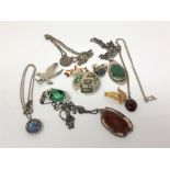 A malachite pendant on silver chain, a silver abalone brooch and similar ring, silver eagle brooch,