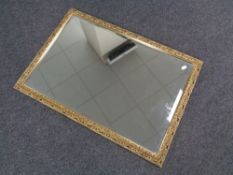 A gilt framed bevelled mirror