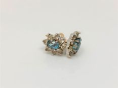 A pair of 9ct gold topaz set cluster earrings.