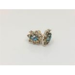 A pair of 9ct gold topaz set cluster earrings.