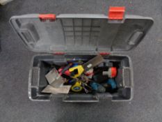 A large plastic tool box of assorted hand tools, Makita drill, spirit level,