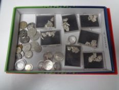 A box of gent's silver ring, seven boxed sets of silver pudding or cracker charms,