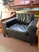 A black leather low back armchair