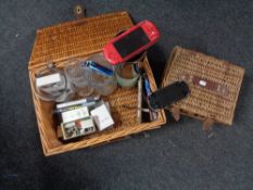 Two baskets of Sony PSP, game and UMD, glass vases, Singer sewing machine accessories,