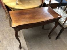 A 19th century mahogany turnover top tea table on cabriole legs